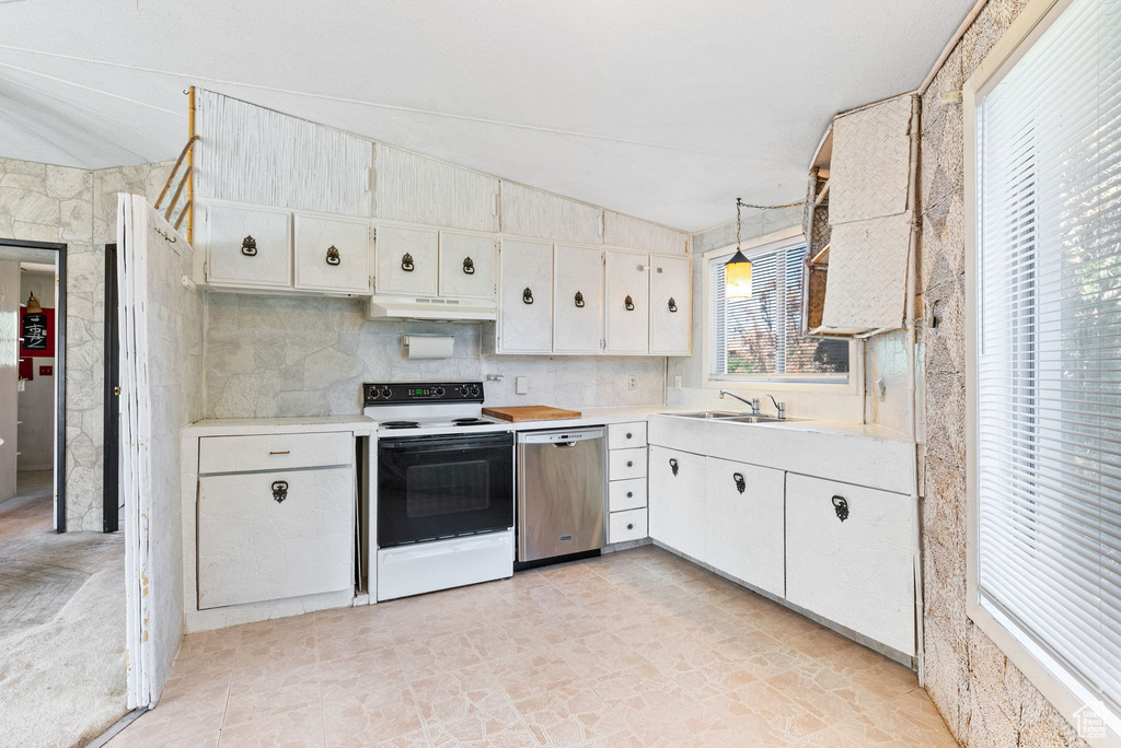 Kitchen with white cabinetry, white electric range oven, pendant lighting, light tile flooring, and dishwasher