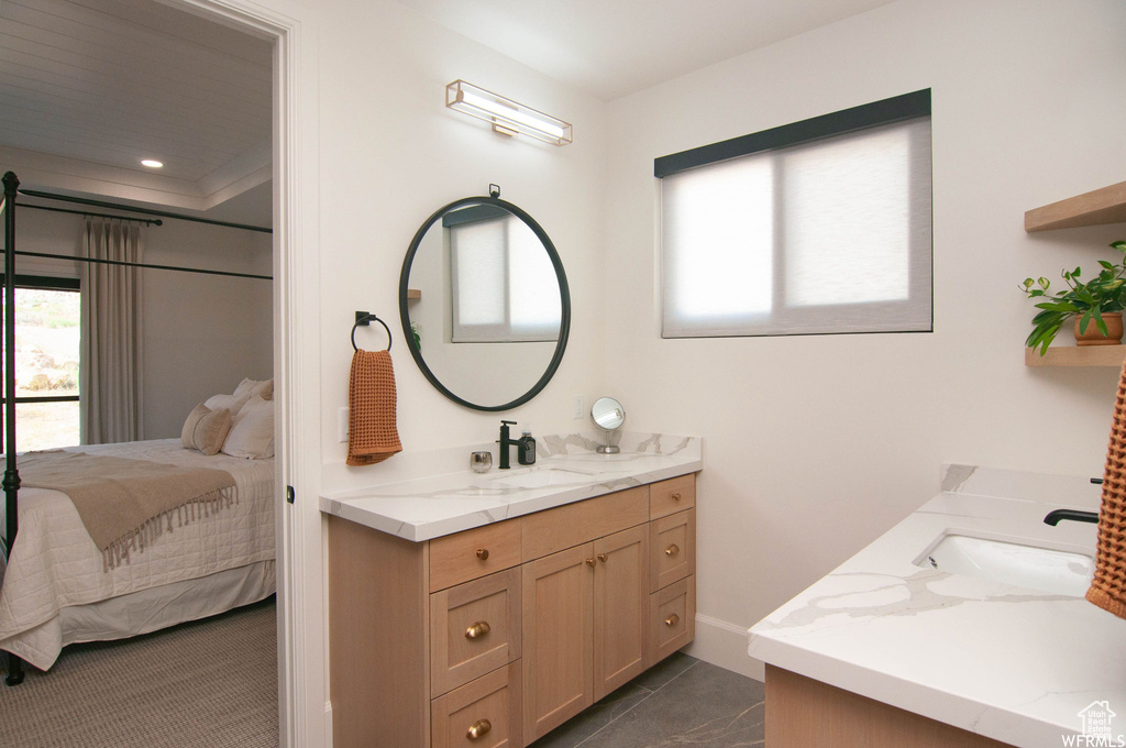 Bathroom featuring vanity and tile floors