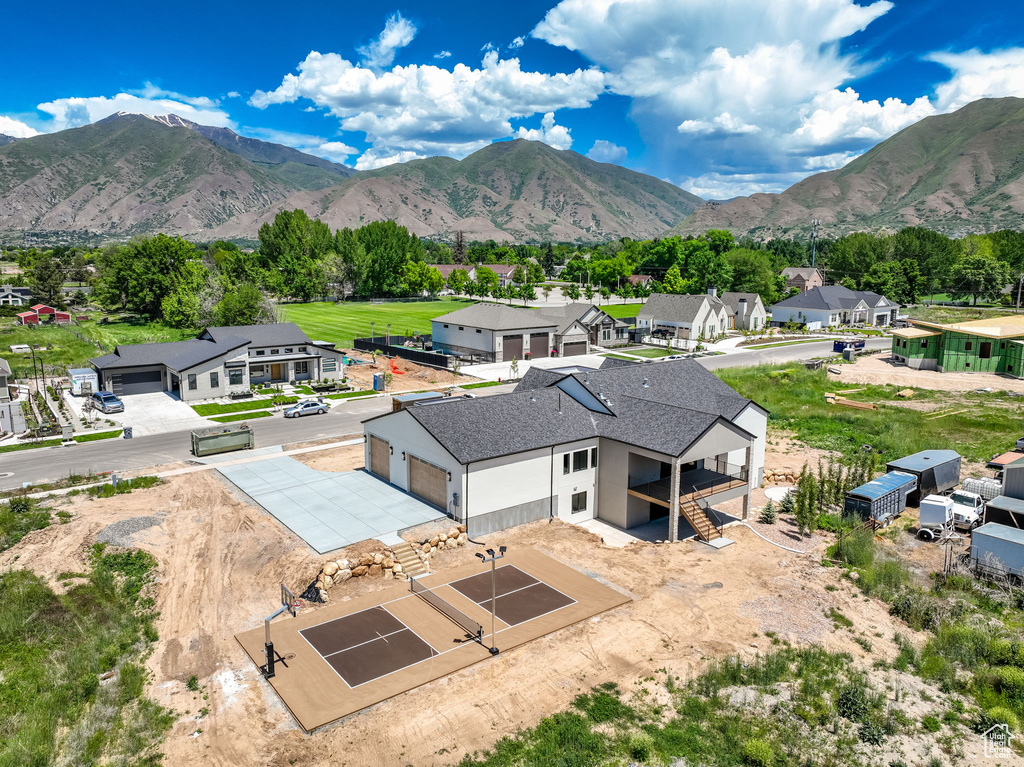 Aerial perspective of suburban area featuring a mountainous background