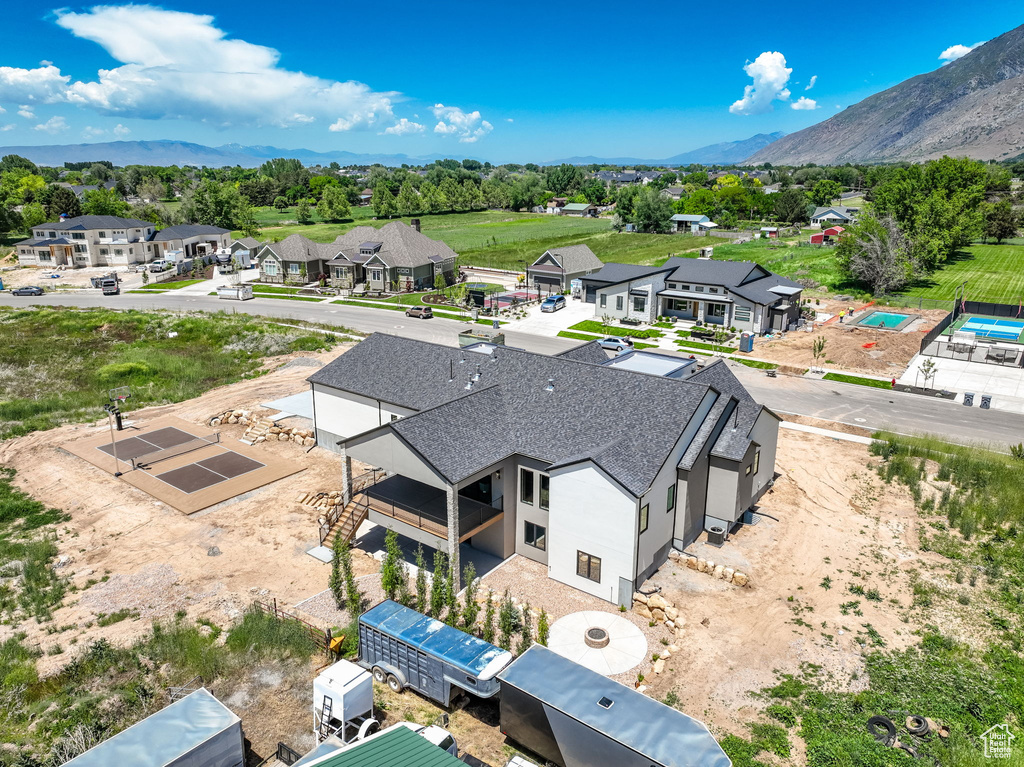 Aerial view of residential area featuring a mountainous background