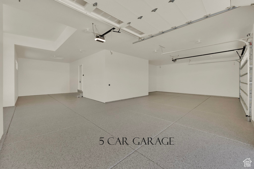 Garage featuring a garage door opener