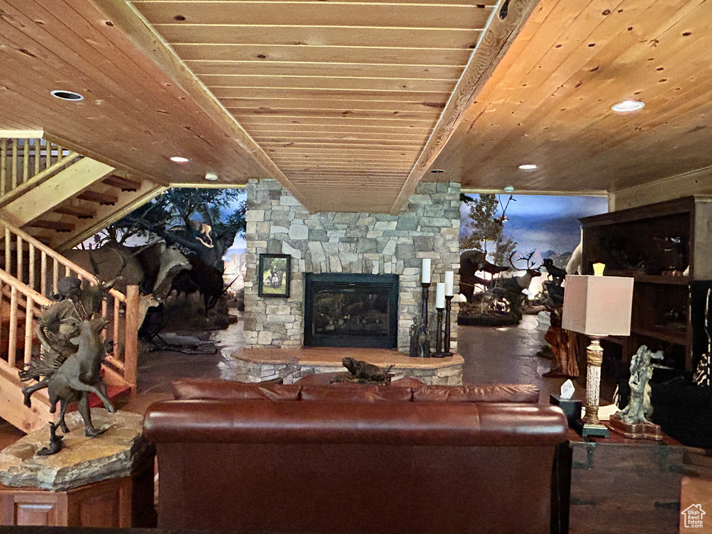 Living room featuring wooden ceiling and a fireplace