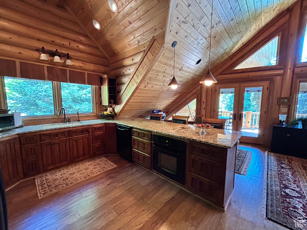 Kitchen featuring black appliances, sink, wood ceiling, and pendant lighting