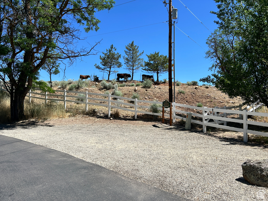 View of yard with a rural view