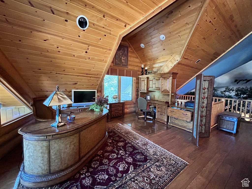 Office space with wooden ceiling, wooden walls, and hardwood / wood-style flooring