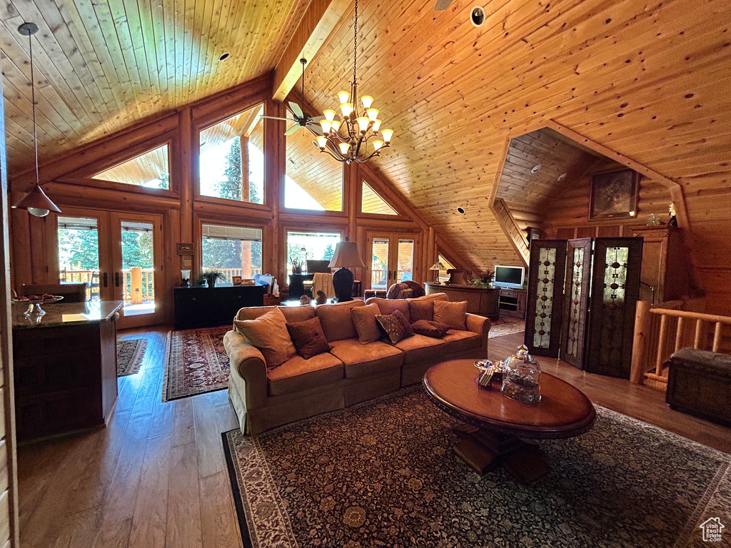 Living room featuring wooden ceiling, french doors, a chandelier, and hardwood / wood-style floors