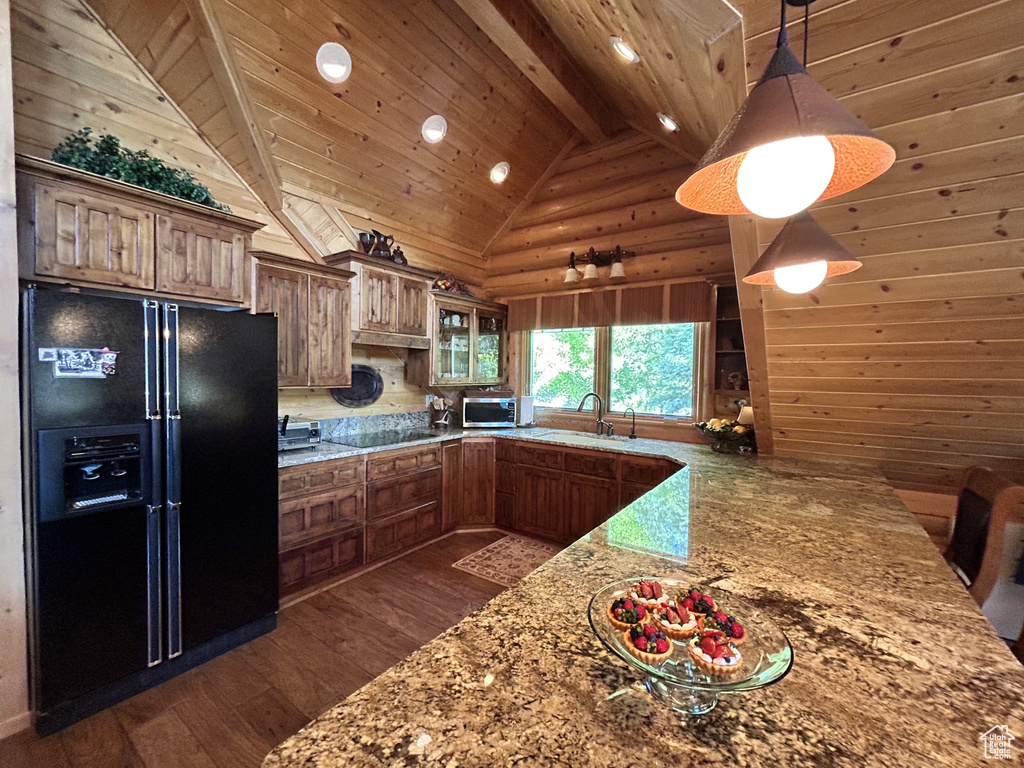 Kitchen with pendant lighting, black appliances, wood ceiling, dark hardwood / wood-style flooring, and sink