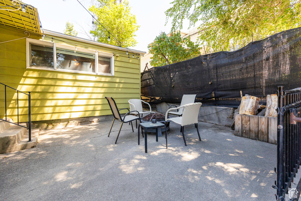 View of patio featuring an outdoor fire pit