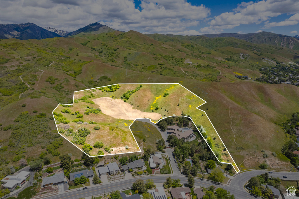 Birds eye view of property with a mountain view