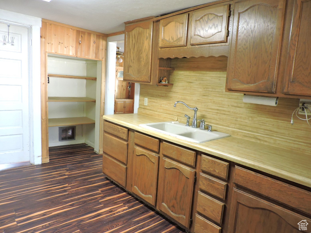 Kitchen featuring sink and dark hardwood / wood-style floors