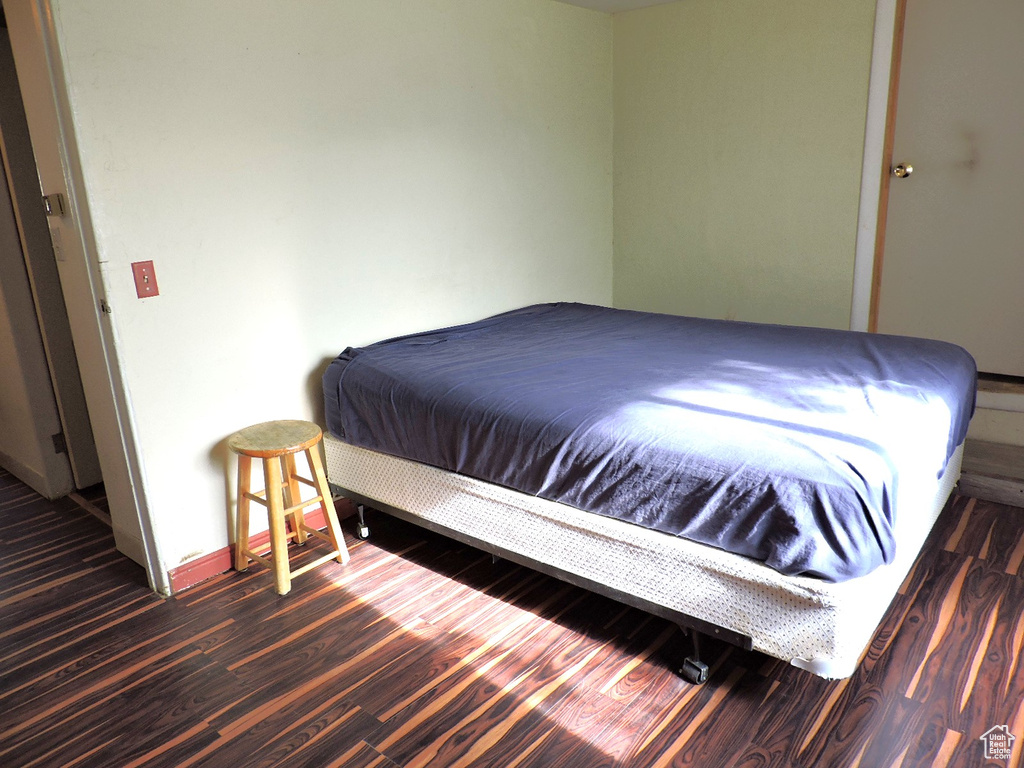 Bedroom featuring dark hardwood / wood-style floors