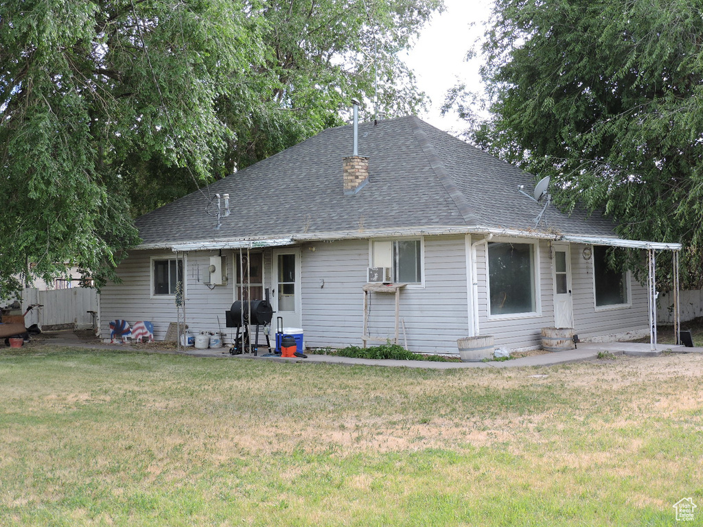 View of front of property with a front yard