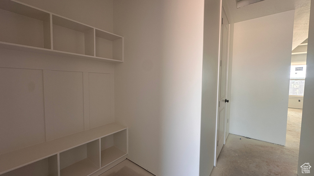 Mudroom featuring concrete flooring