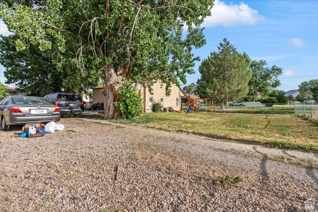 View of front of property featuring a playground