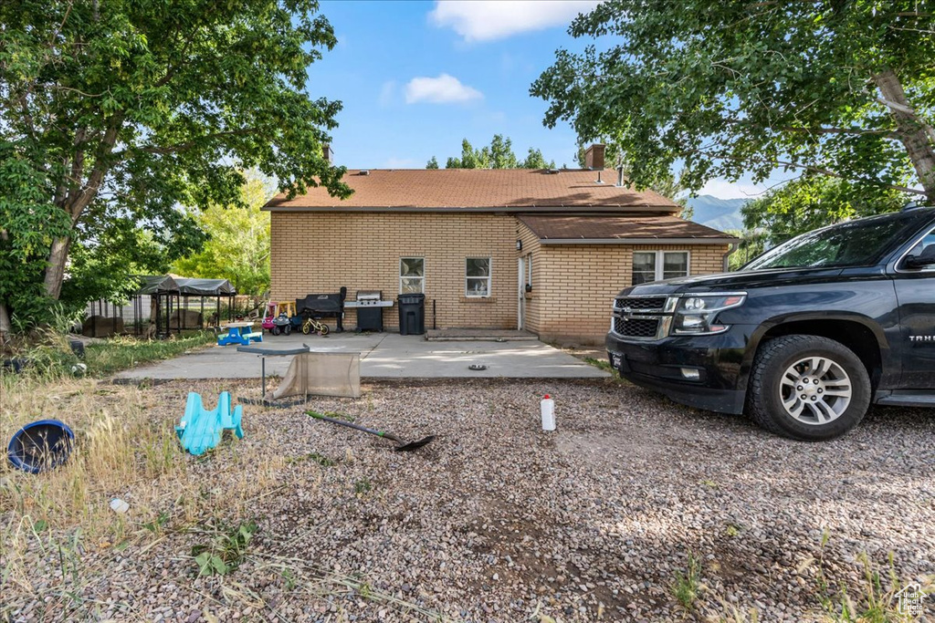 Back of property featuring a patio area