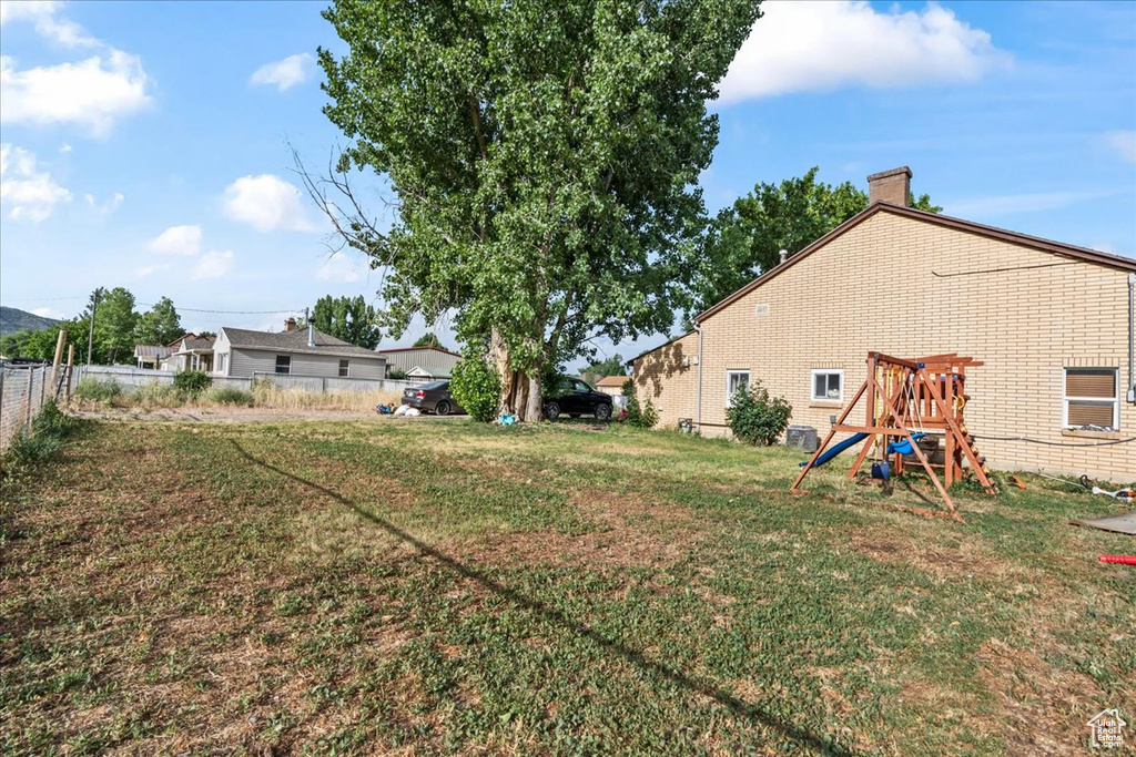 View of yard featuring a playground