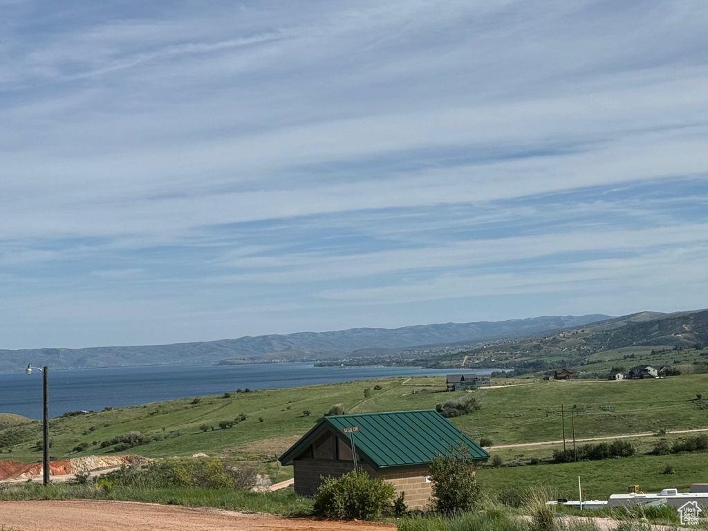 View of mountain feature with a water view and a rural view