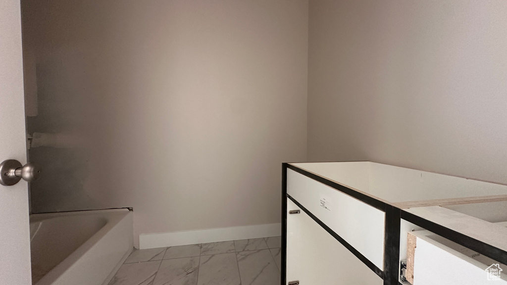 Bathroom with vanity and a tub to relax in