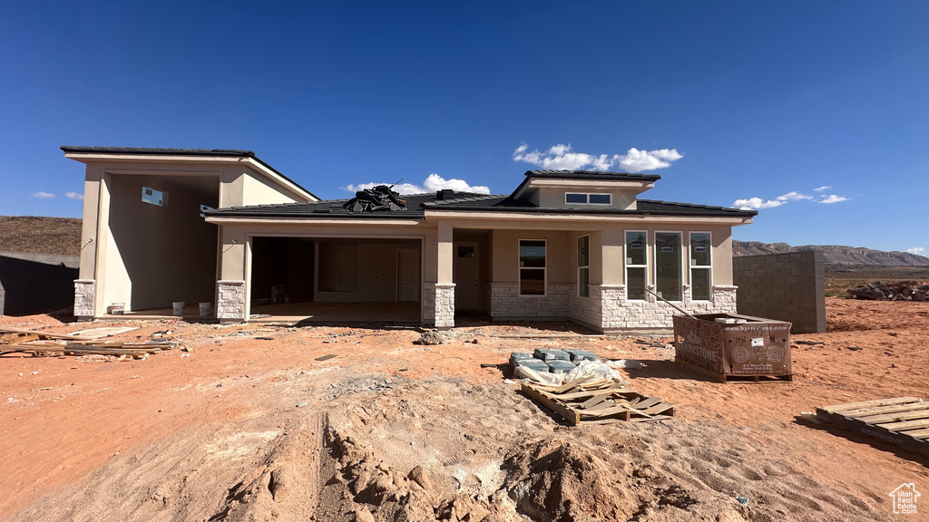 Prairie-style house featuring a mountain view