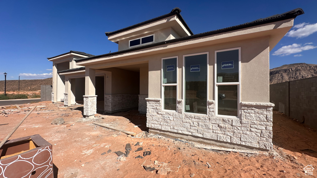 Exterior space with a patio area and a mountain view