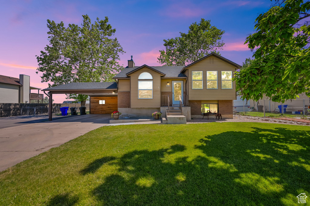 View of front of home featuring a lawn