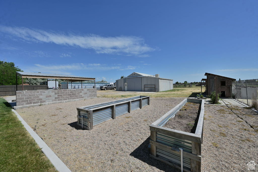 View of play area featuring an outdoor structure