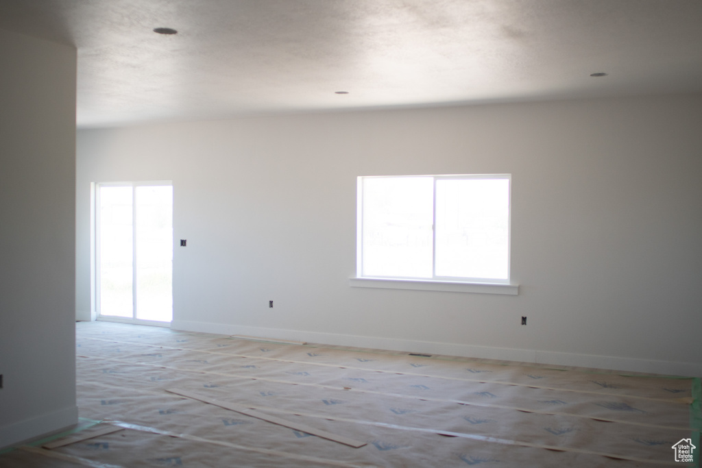Spare room featuring baseboards
