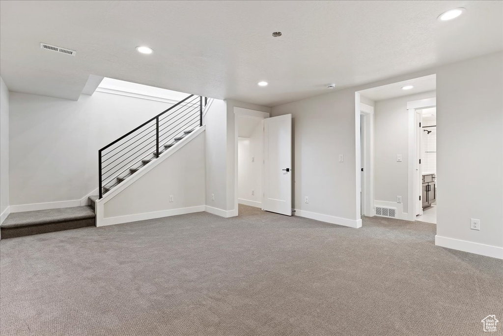 Basement featuring carpet flooring