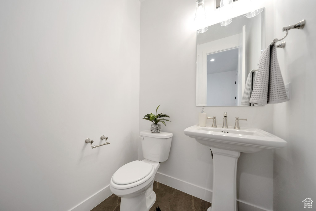 Bathroom with tile patterned flooring and toilet