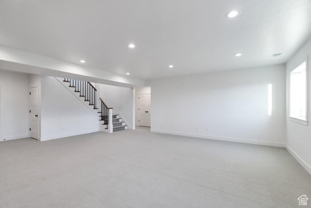 Basement with carpet flooring