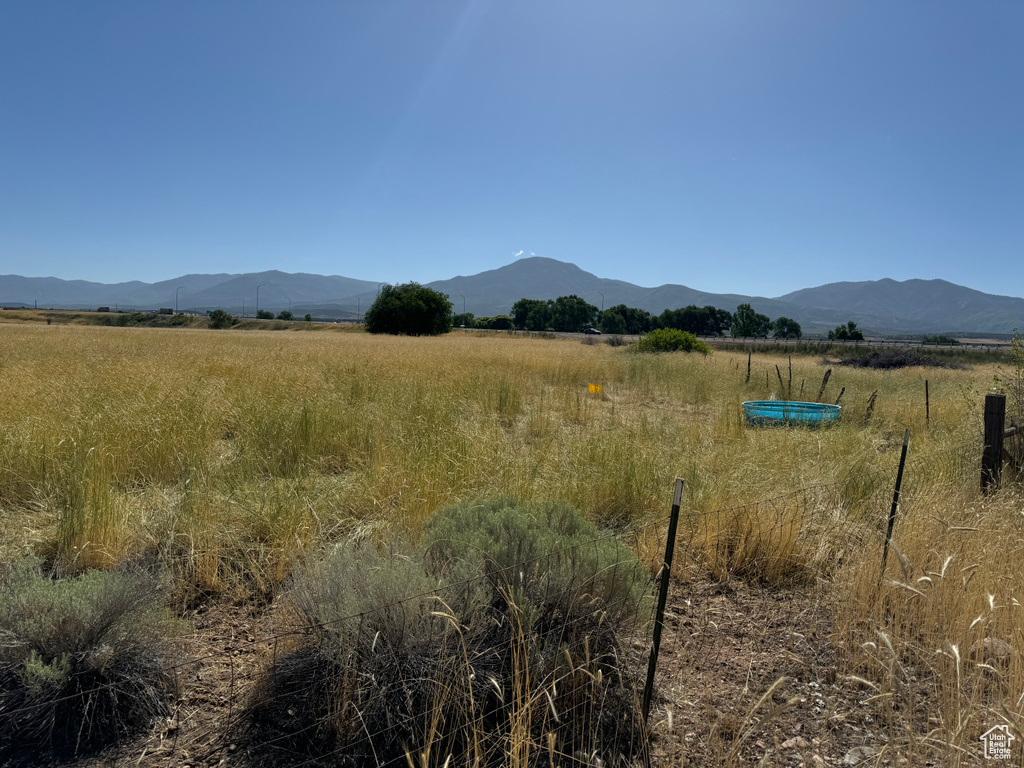 Property view of mountains with a rural view