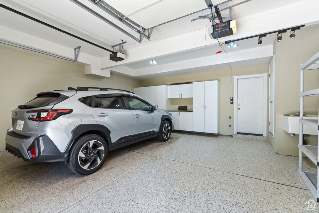 Garage featuring a garage door opener