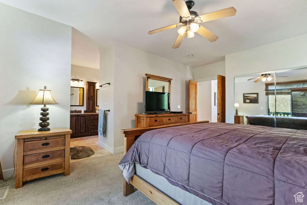 Tiled bedroom with a closet and ceiling fan