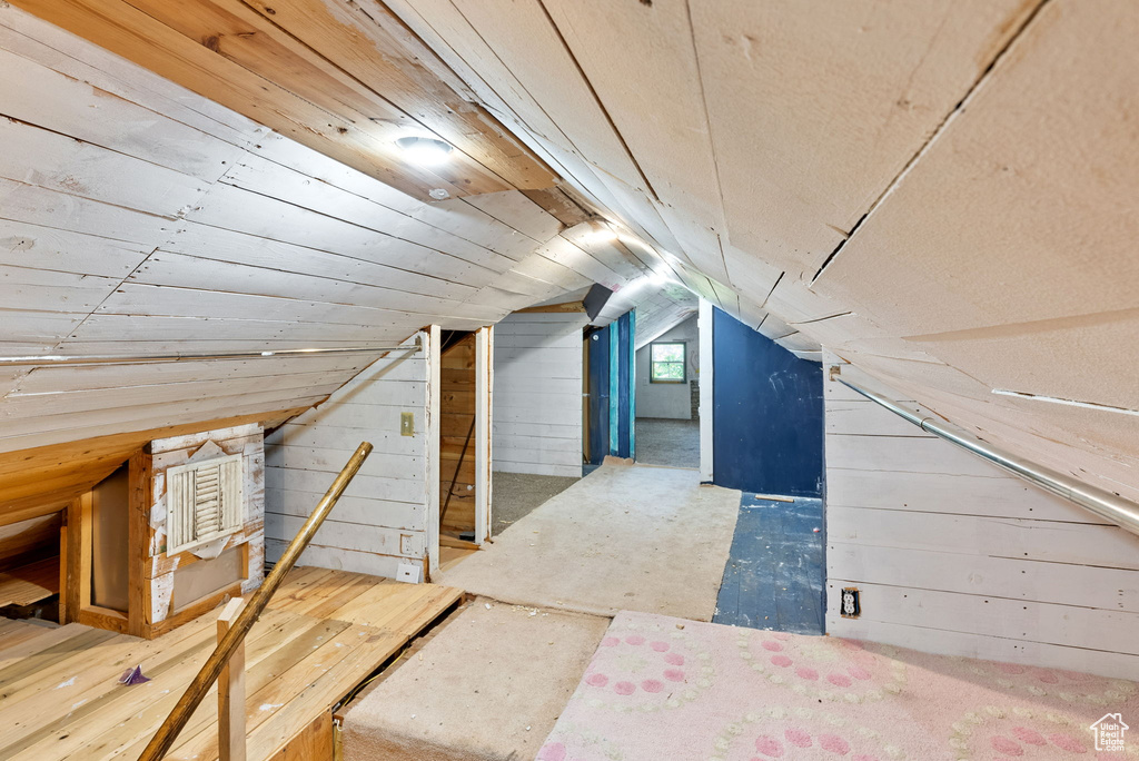 Additional living space featuring lofted ceiling