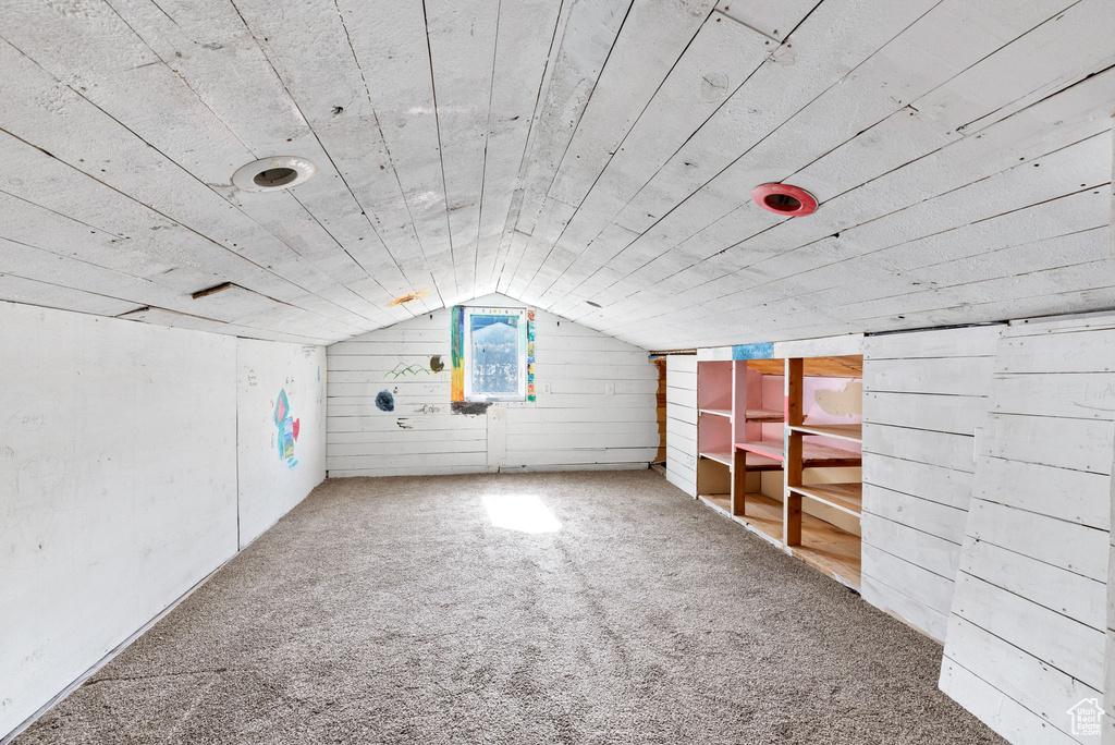 Bonus room with vaulted ceiling and carpet floors