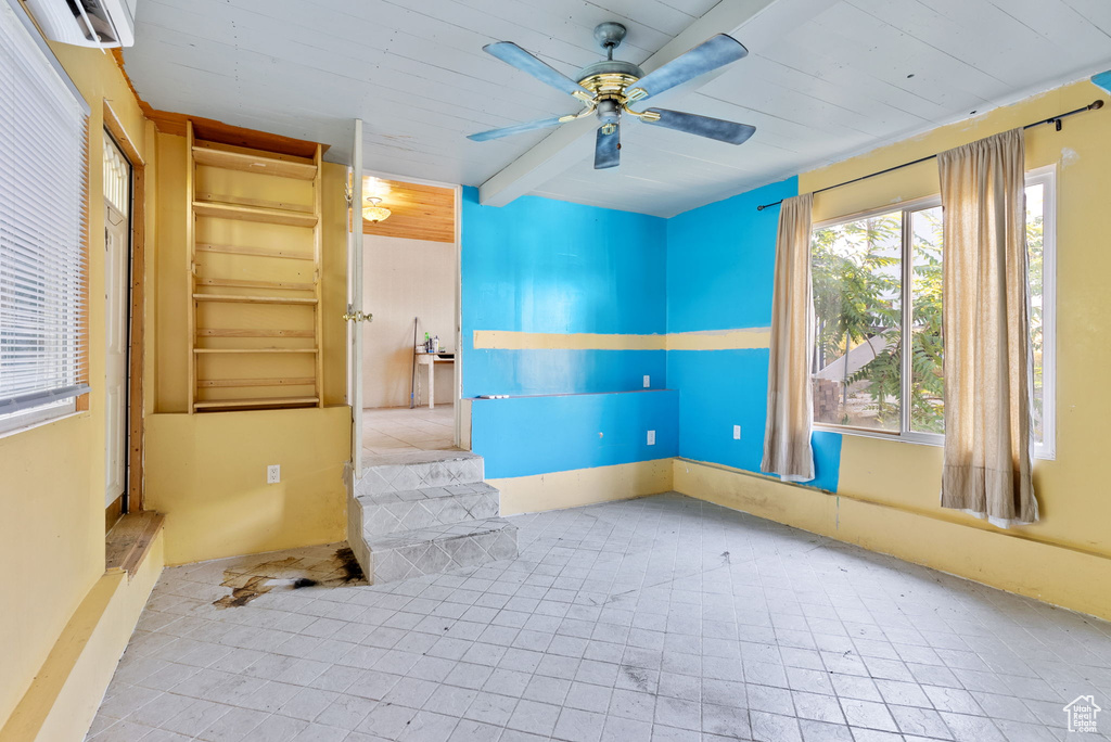 Spare room with tile flooring and ceiling fan