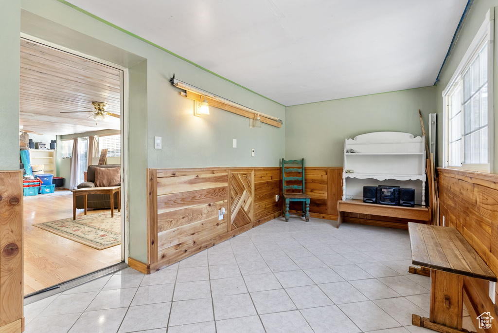 Interior space with tile flooring, plenty of natural light, and ceiling fan