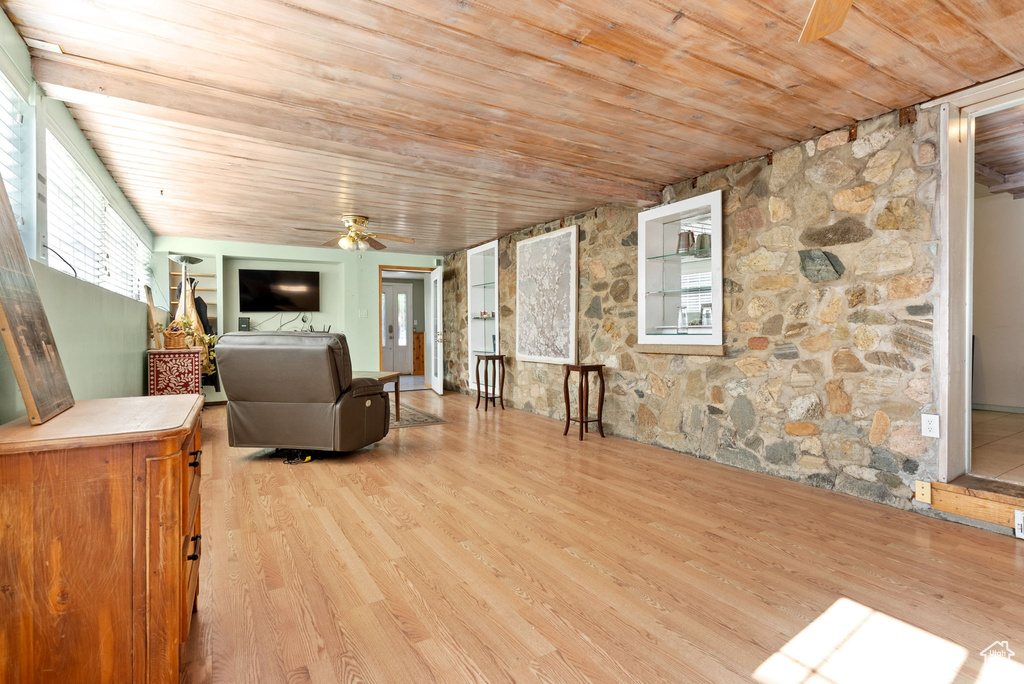 Unfurnished room with wood ceiling, ceiling fan, and light hardwood / wood-style flooring