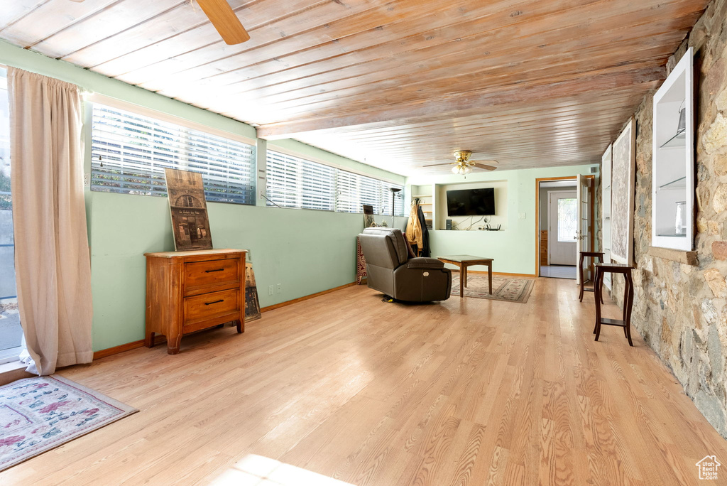 Living area featuring wood ceiling, ceiling fan, and hardwood / wood-style floors