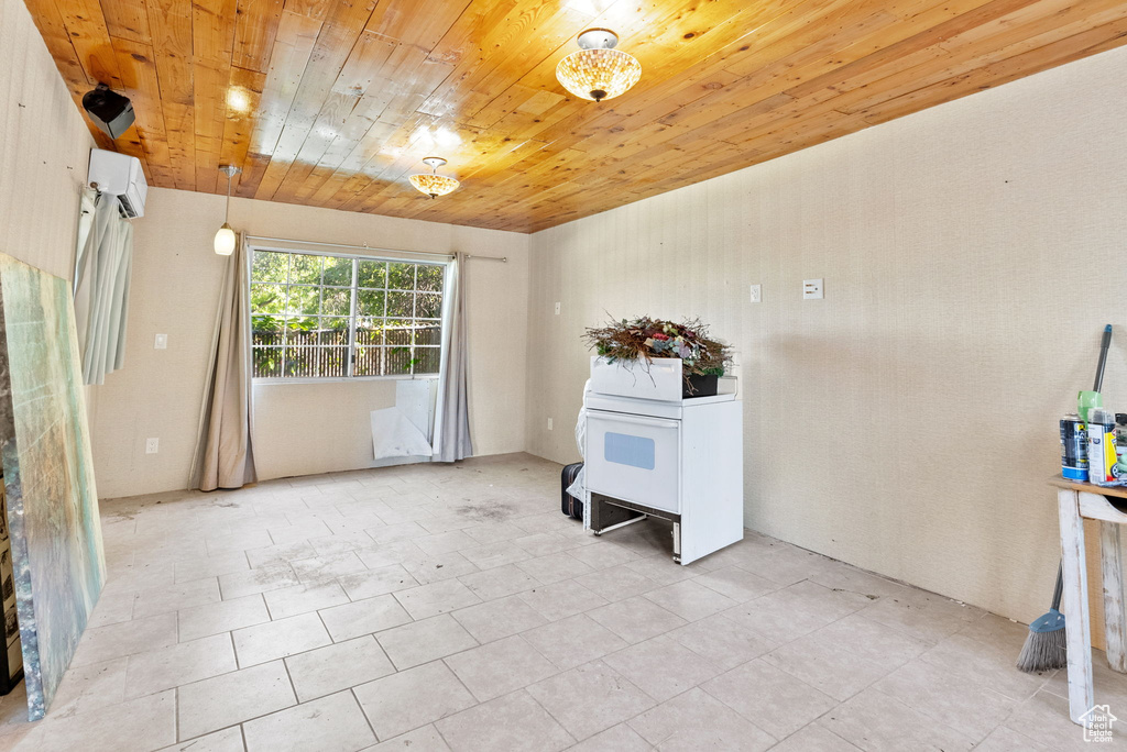 Interior space featuring wooden ceiling and light tile flooring