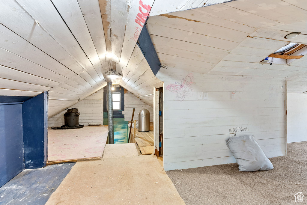 Additional living space featuring vaulted ceiling