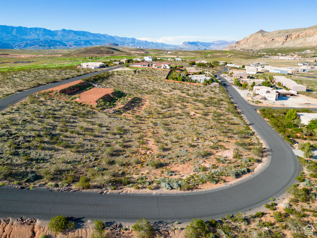 Birds eye view of property with a mountain view