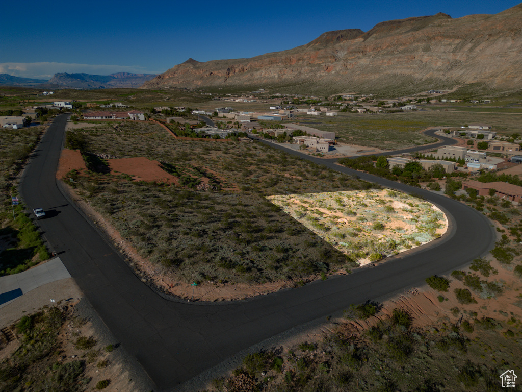 Birds eye view of property with a mountain view