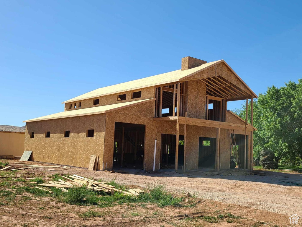 Rear view of property featuring a balcony