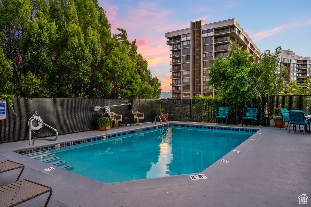 View of pool at dusk