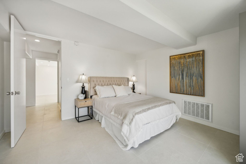 Bedroom with light tile floors