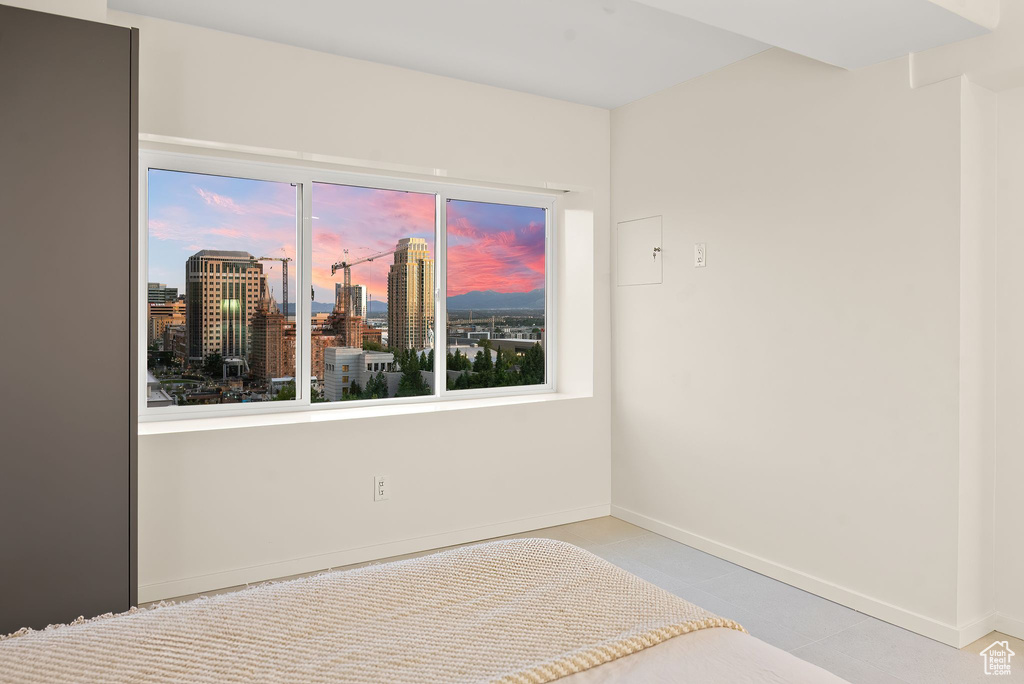 Unfurnished bedroom with tile floors