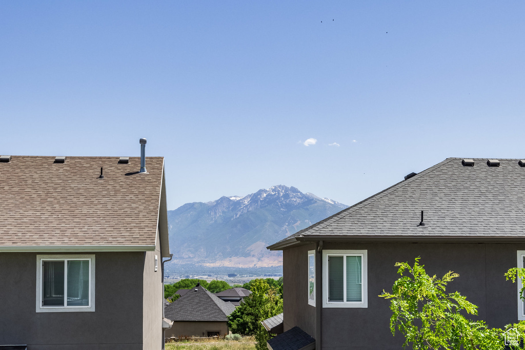 View of side of home featuring a mountain view