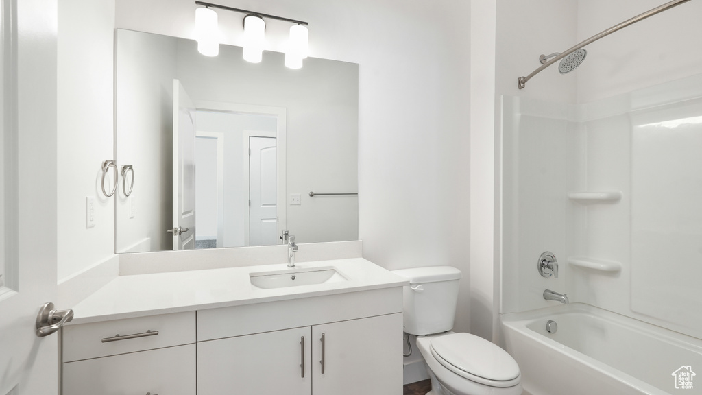 Full bathroom with shower / tub combination, toilet, and vanity