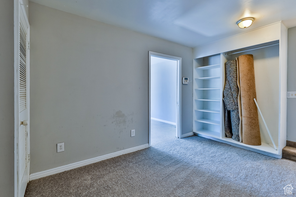 Unfurnished bedroom with carpet floors